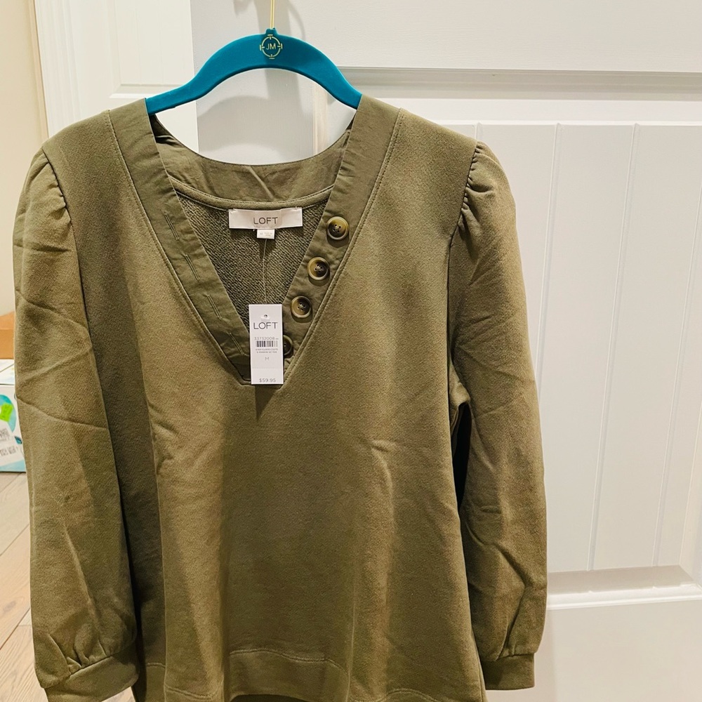 Sweatshirt material top with button accents